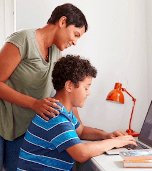 Parent helping child with virtual learning