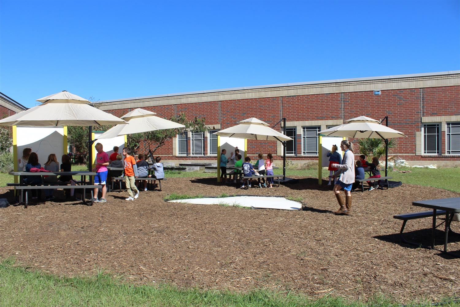 students learning in outdoor classroom